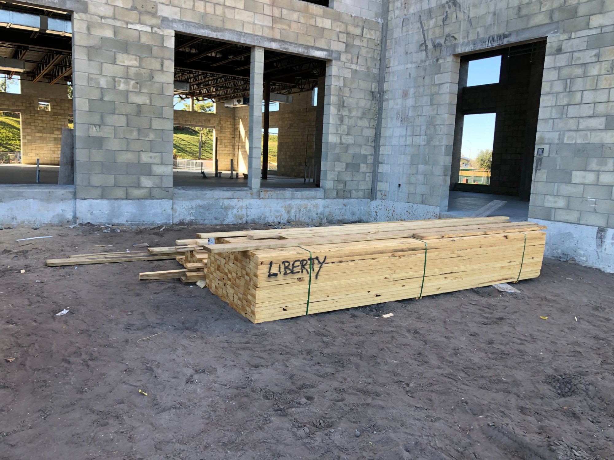 A Liberty-marked lumber package staged inside the finished block shell