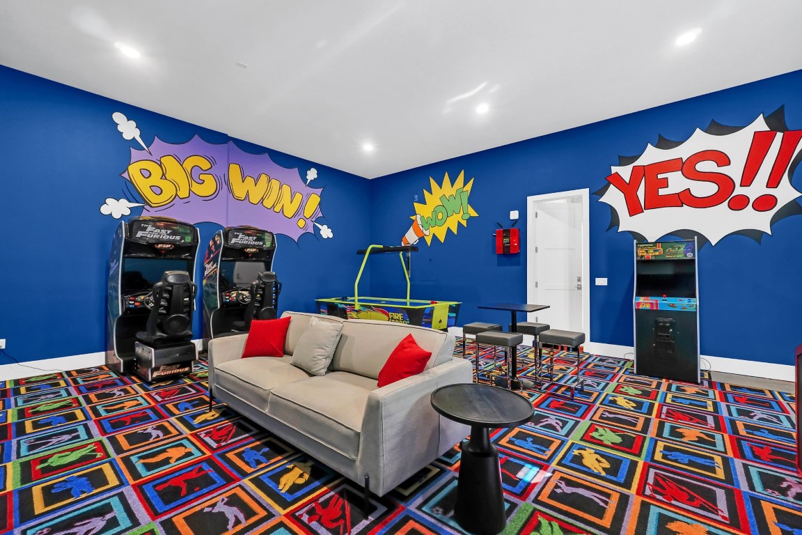 Arcade game room with hand-painted comic-book murals