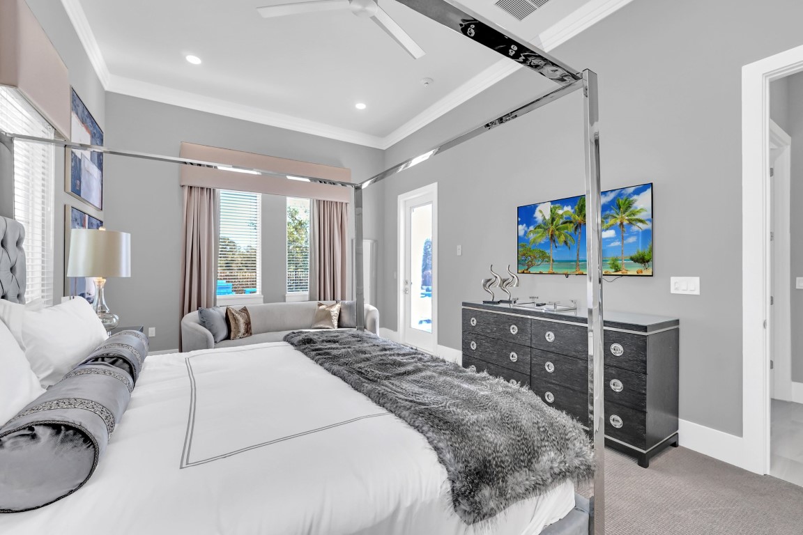 Primary suite with a chrome canopy bed