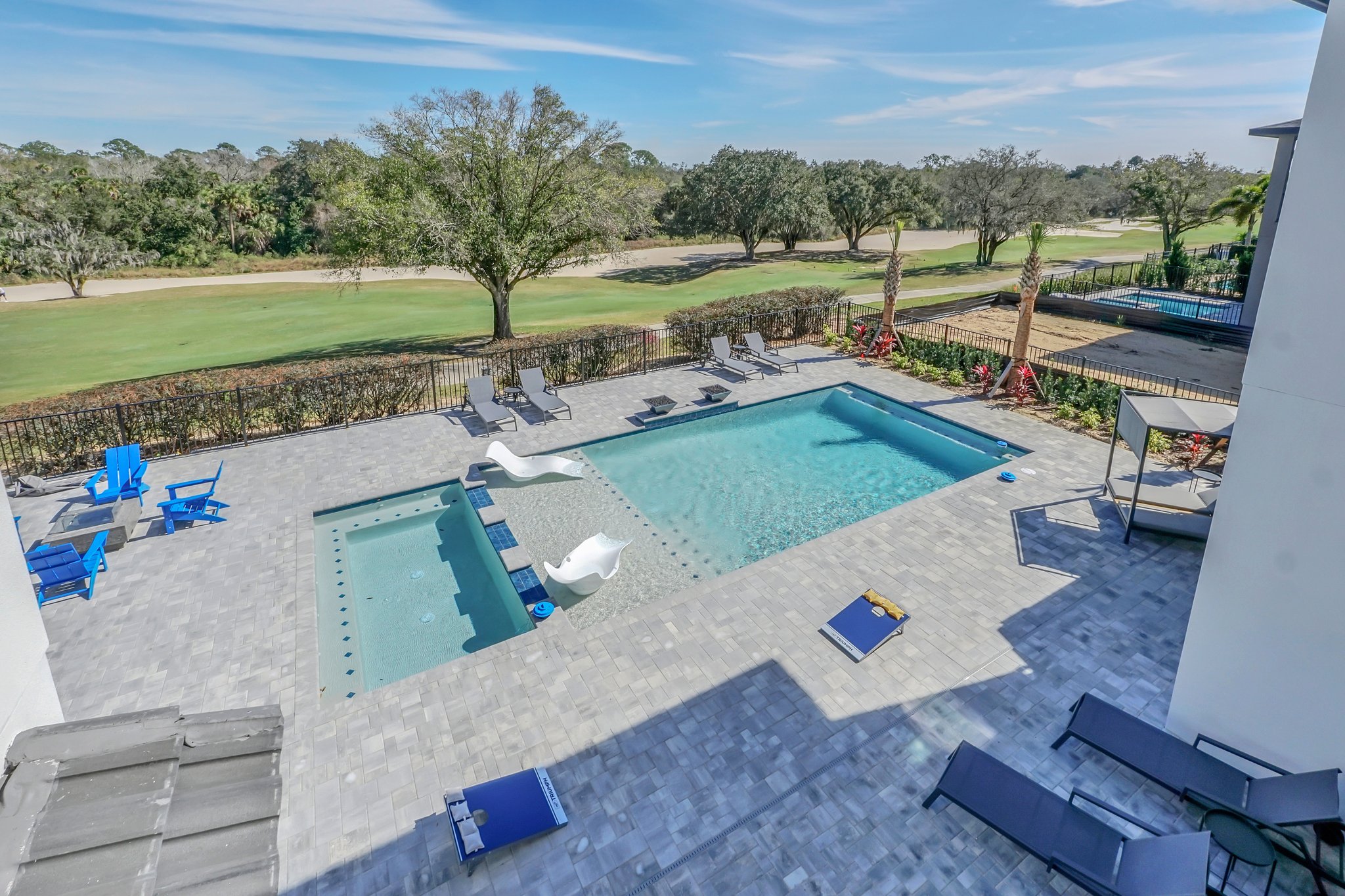 Excitement Drive — elevated view over the resort pool and spa to the Jack Nicklaus fairway