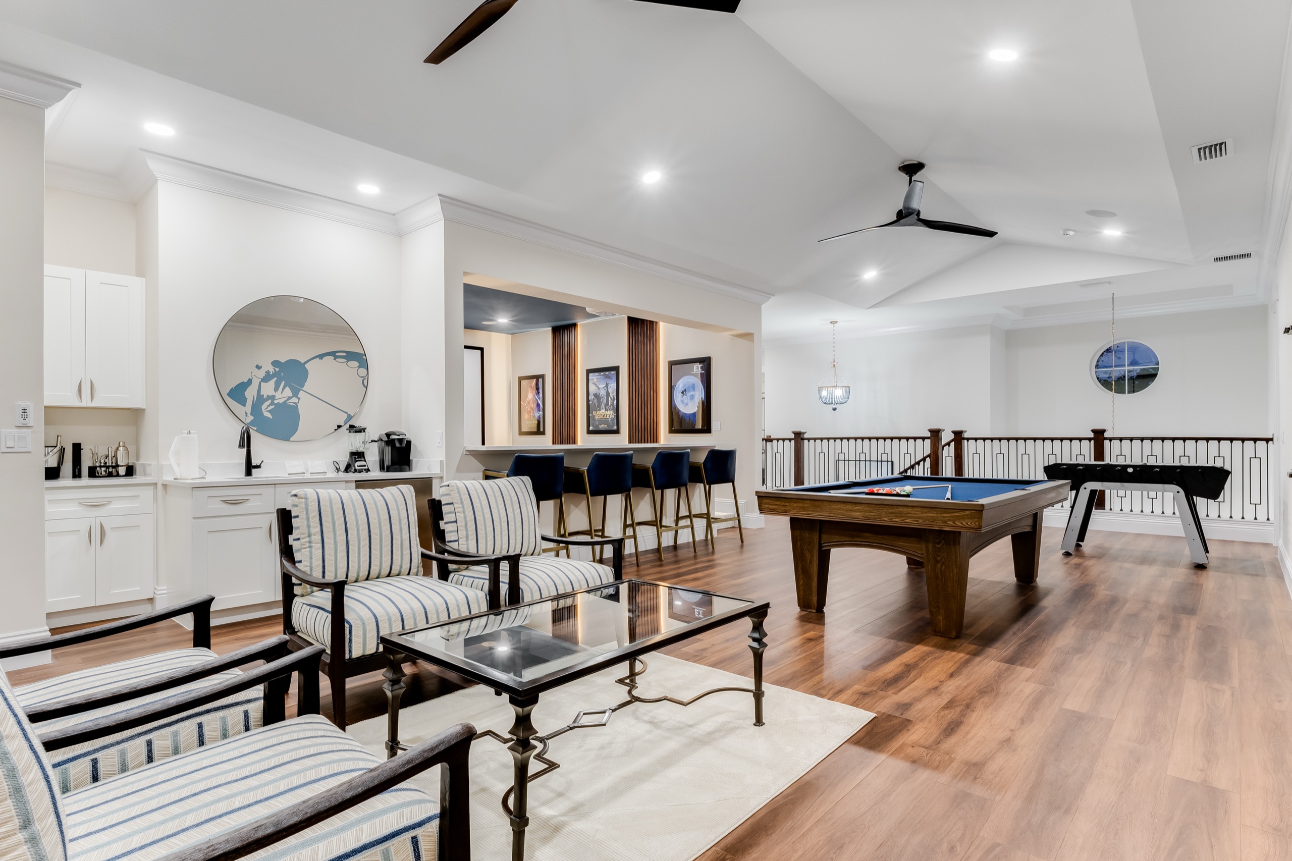 Game floor with billiards, foosball, and lounge seating
