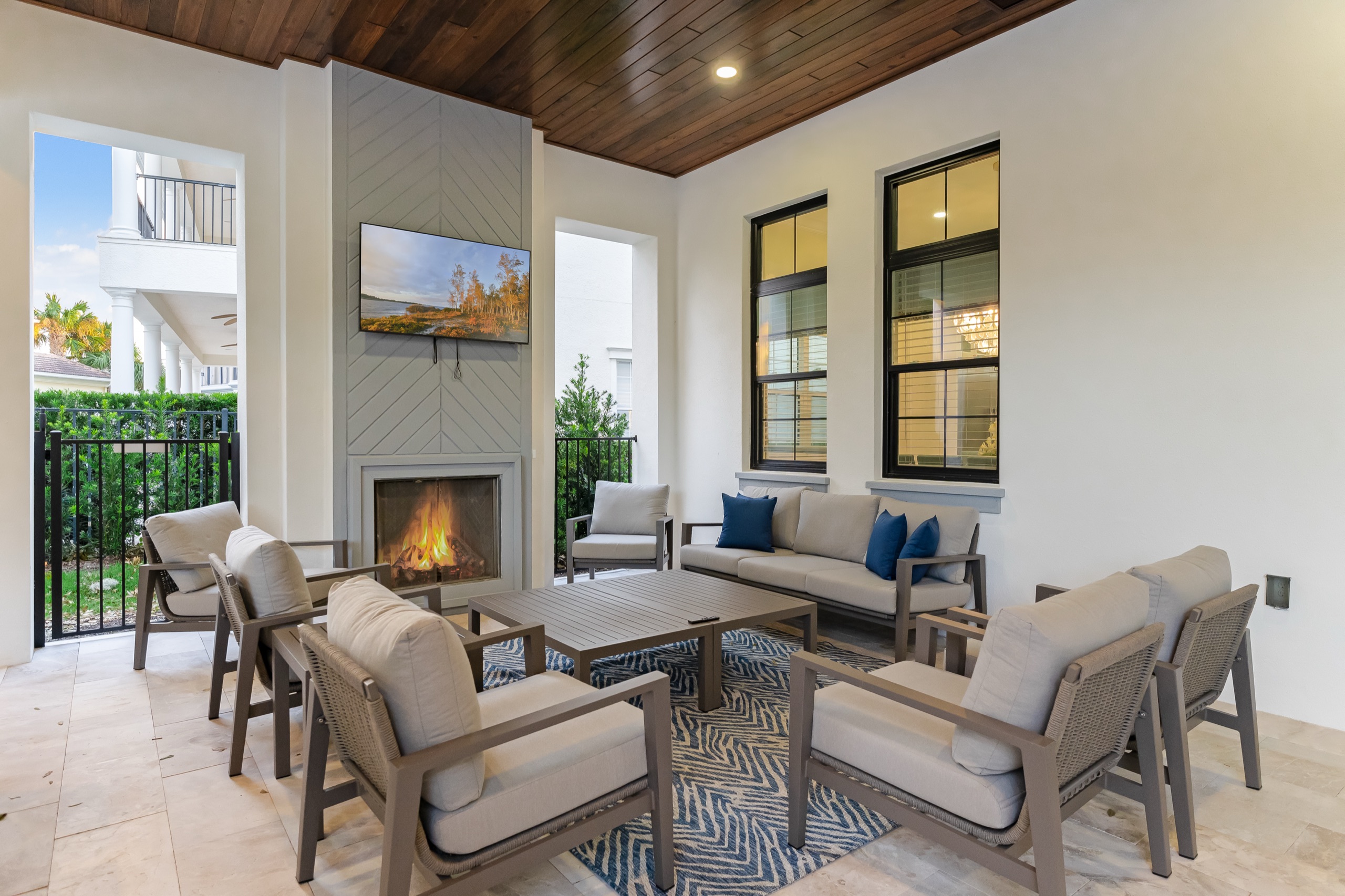 Lanai fireplace lounge with cushioned seating