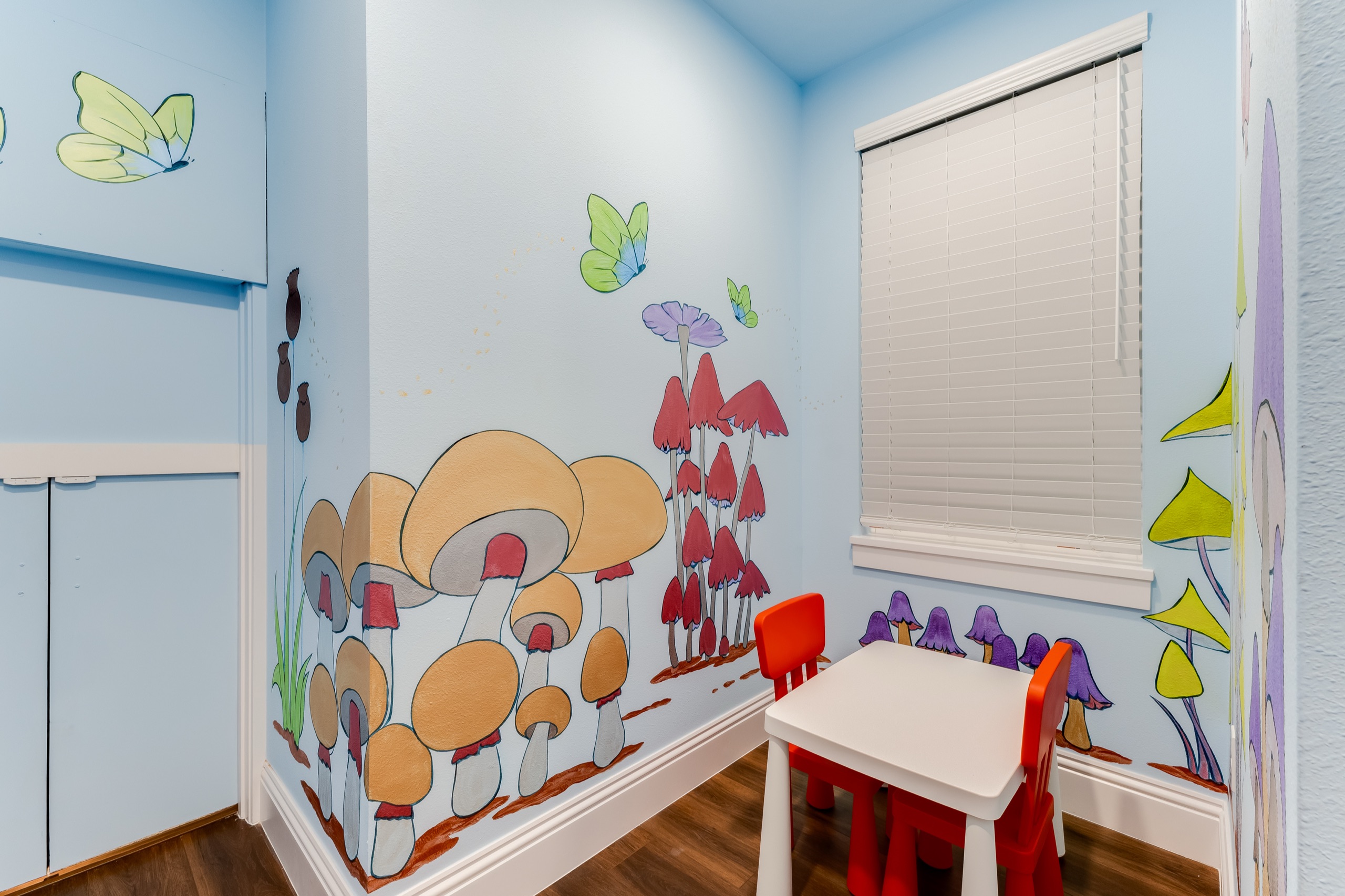 Secret kids' play space tucked behind the loft with the fairy-garden mural
