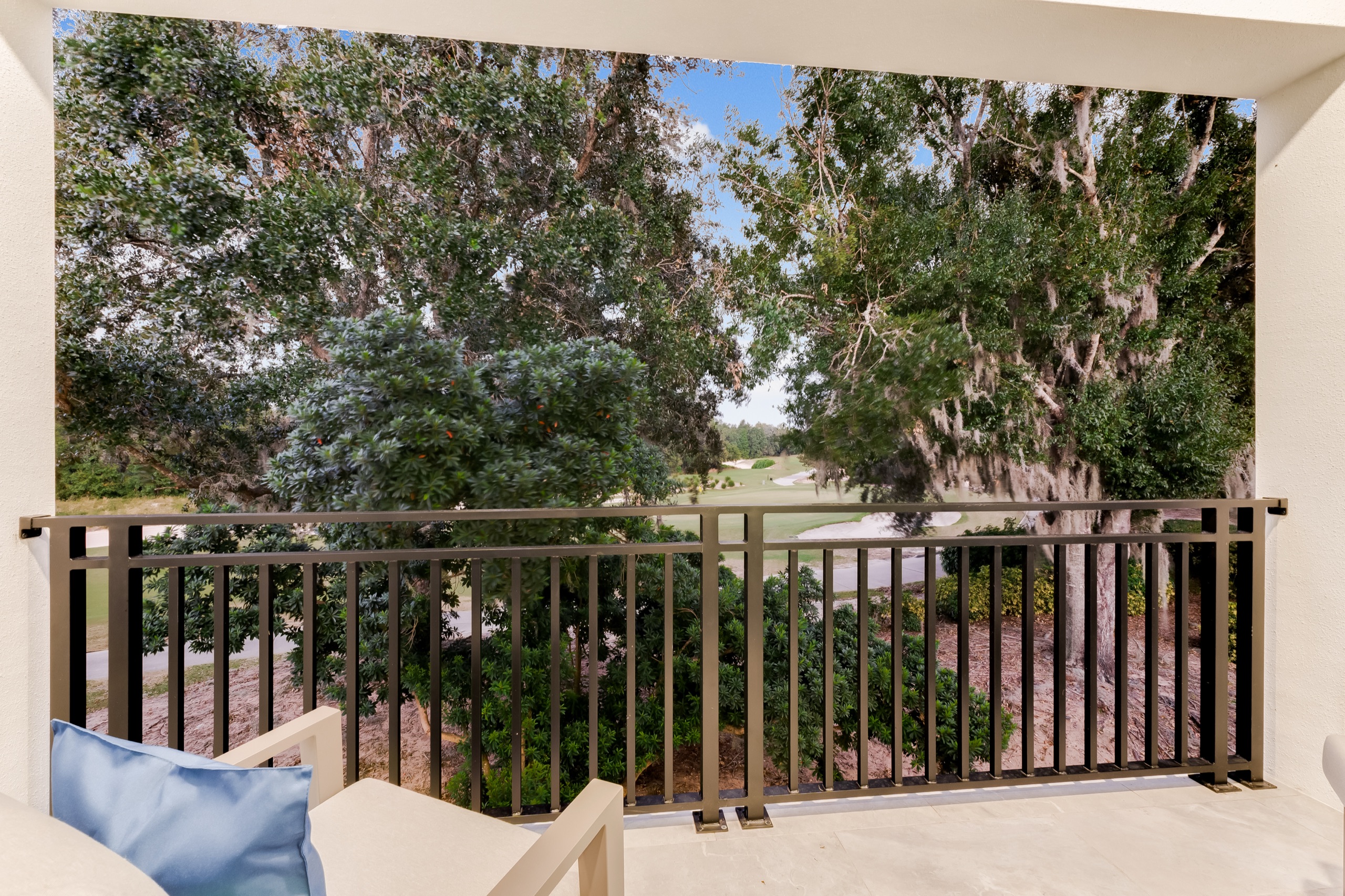 One of two upstairs balconies, looking over the golf course through the oaks