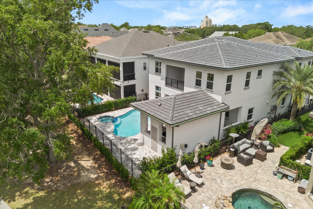 Midway Modern — a contemporary golf-front estate and pool, seen from above