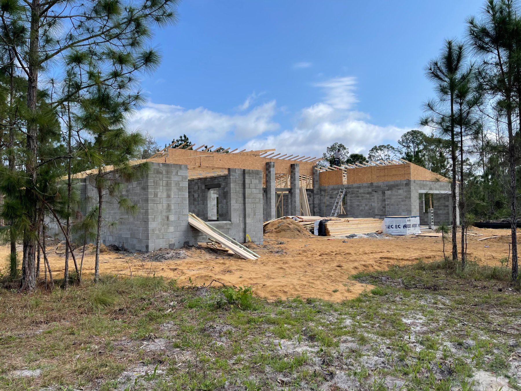 Block shell and roof framing rising on a Liberty build