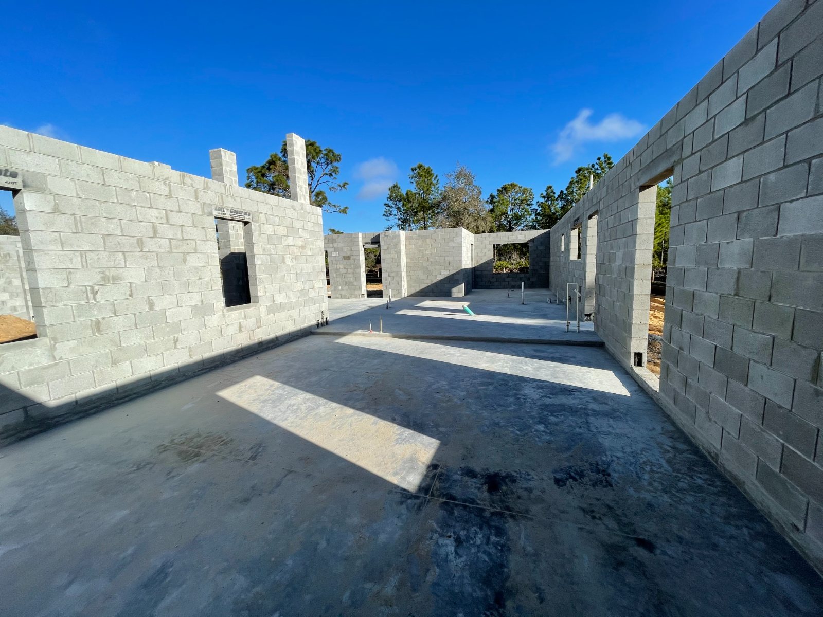 Concrete-block walls raised over the poured slab