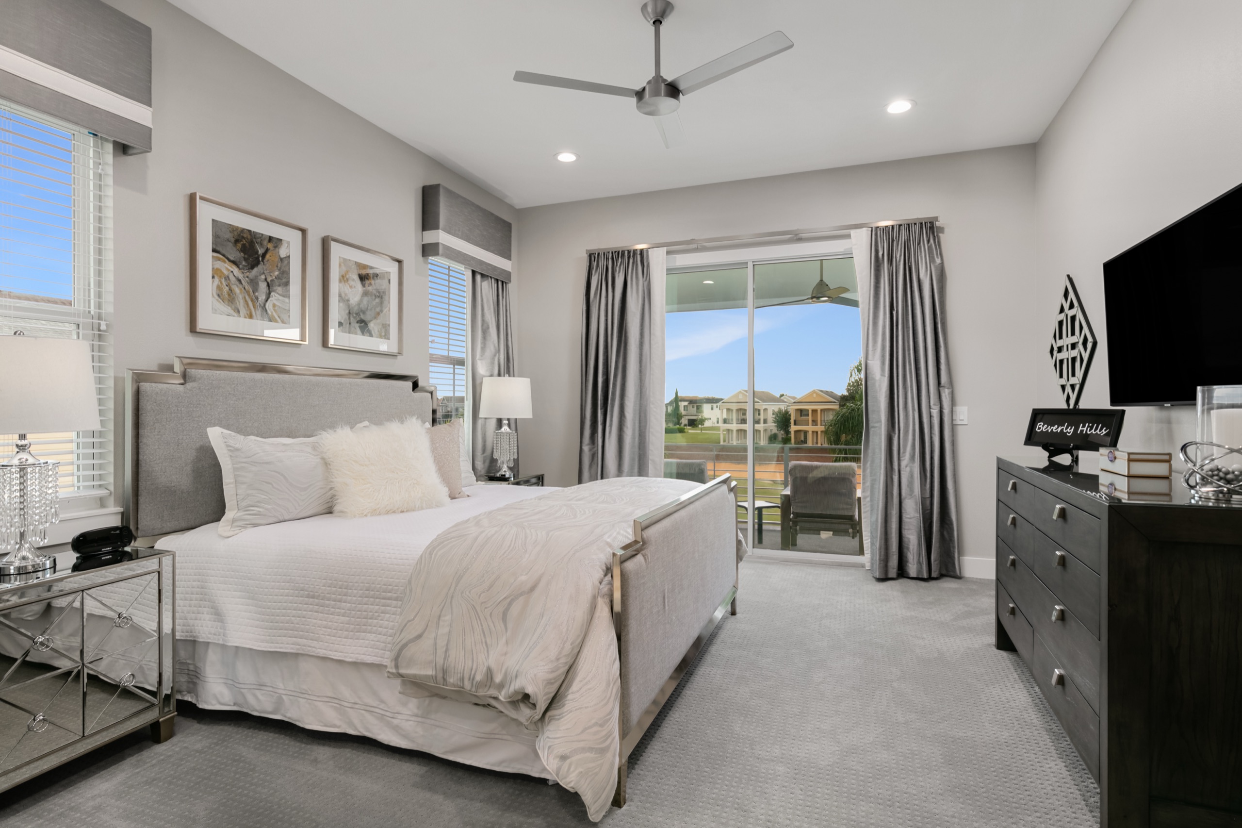 Beverly Hills suite in soft gray with mirrored nightstands and a private balcony over the fairway