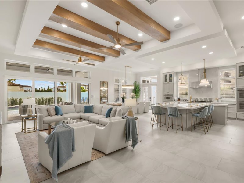 Great room open plan with sectional seating and the kitchen beyond