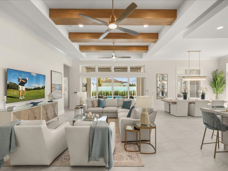 Open great room with wood-beam ceiling flowing into the kitchen