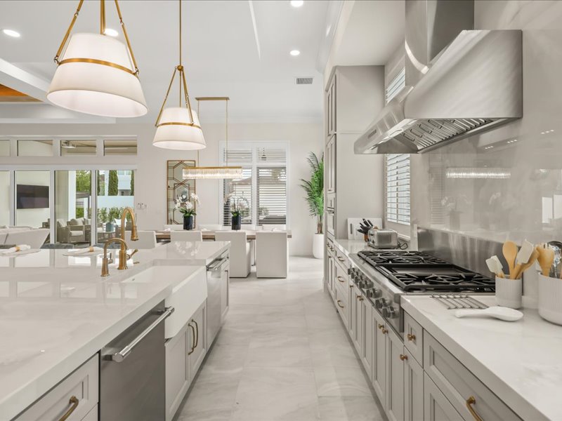 Professional range and marble counters with a stainless hood