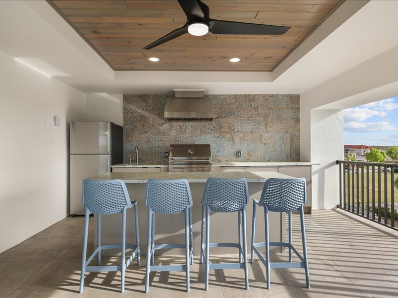 Built-in grill and stone counter on the covered lanai