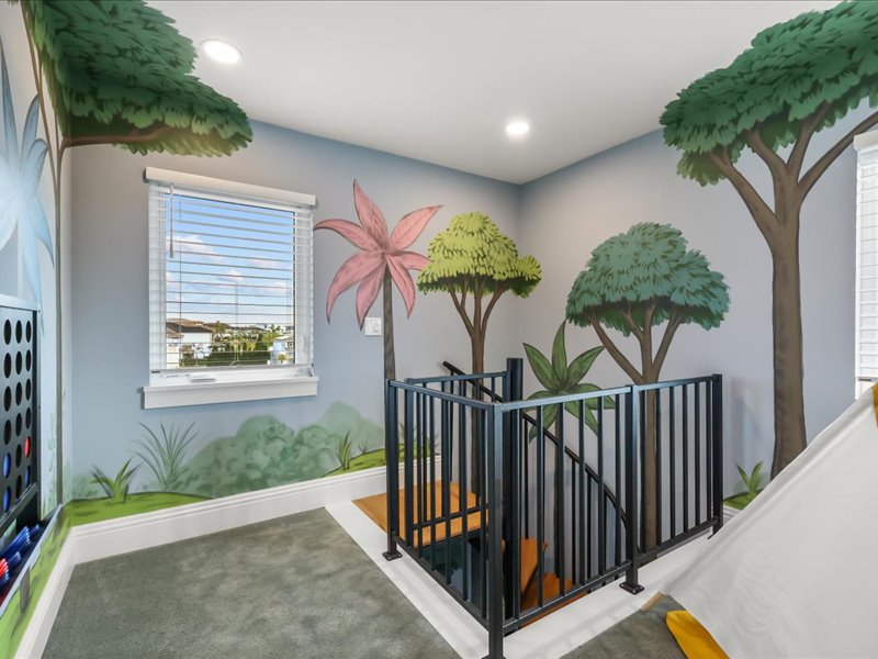 Loft landing painted with a tree mural above the resort floor